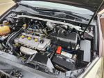 Engine compartment of a 2005 Lexus ES 330 with maroon exterior and tan interior.
