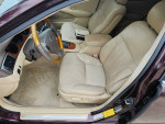 Interior view of a 2005 maroon Lexus ES 330 with tan leather seats and wooden accents.