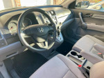 Interior view of a well-maintained 2008 Honda CR-V, featuring a sleek dashboard and comfortable seating.