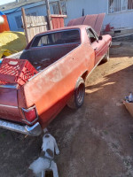 19768 El Camino in need of body work, perfect for project car enthusiasts, showcasing its stock 307 motor.