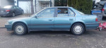 Side view of a 1990 Honda Accord with clean title, good condition, and new tires, ideal for first-time drivers.