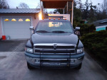 Front view of a 1995 Dodge 3500 dually truck parked in a driveway, showcasing its robust design.