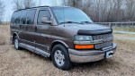2004 Chevrolet Express 1500 AWD van in brown, featuring leather seating and a comfortable interior for family travel.