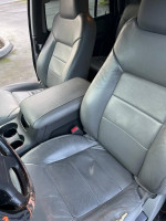 Interior view of a 2003 Ford Expedition with clean leather seats and spacious design.