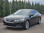 2015 Honda Accord Sport in black, 124k miles, well-maintained, parked among greenery.