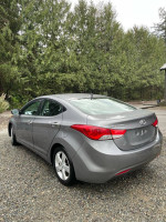 2013 Hyundai Elantra GLS in gray, showcasing its sleek design and well-maintained exterior with a salvage title.