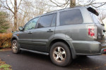 2007 Honda Pilot EX-L SUV in very good condition with 63,000 miles, featuring alloy wheels and third-row seating.