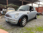 2004 MINI Cooper in silver color, parked on gravel, needs clutch replaced, one owner, 112,000 miles