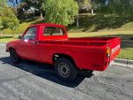 1983 Toyota Pickup in red, well-maintained with a reliable 22R engine and manual transmission.