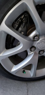Close-up of a silver wheel with a Brembo brake caliper on a 2013 Buick Regal GS