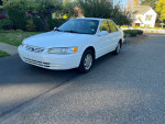 1999 Toyota Camry CE in white, 135,000 miles, well-maintained with new parts, clean title, great fuel economy