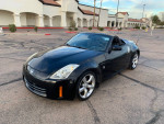 2008 Nissan 350Z convertible in excellent condition with 132,000 miles parked outdoors