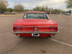Red 1968 Ford Mustang rear view, showcasing classic design and newer wheels in Arizona.