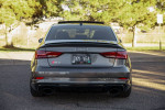 Rear view of a 2019 Audi RS3 in Daytona Gray Pearl Effect parked outdoors
