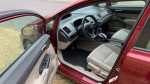 Interior view of a 2010 Honda Civic LX showing seats and dashboard features for sale.