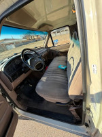 Interior view of a well-maintained 1992 Ford F-150 with a clean dashboard and seating.