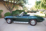1967 Chevrolet Corvette Convertible in green color, restored, showcasing classic design and pristine condition.
