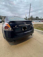 Rear view of a 2007 Nissan Altima 3.5 SE with a clean Texas title, great fuel efficiency and leather interior.