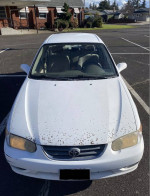 2001 Toyota Corolla CE Sedan, front view, showing exterior condition and classic design.