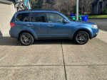 2009 Subaru Forester 2.5X AWD in good condition parked outside, featuring stylish alloys and clean exterior.