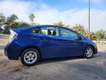 2011 Toyota Prius One FWD in blue with gray interior, showcasing alloy wheels and hybrid engine.