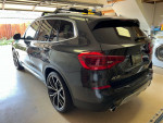 2019 BMW X3 in excellent condition with panoramic roof and premium wheels parked in garage