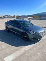 2016 Hyundai Sonata SE parked in a lot, showcasing its sleek design and low mileage features.