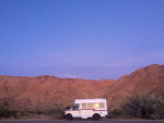 1997 Ford E-350 parked in scenic mountainous landscape, showcasing its rugged charm and low mileage.