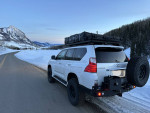 2010 Lexus GX 460 4WD parked in snowy mountain landscape, showcasing modifications for off-road adventures.