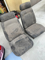 Dirty vintage Chevrolet Camaro seats for project car restoration, stored indoors for years.