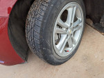 Close-up of the tire on a 2018 Chevrolet Cruze, showing tread wear on the driver's side.