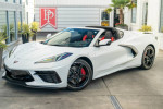 2022 Chevrolet Corvette Stingray RWD in Arctic White with Adrenaline Red interior parked outdoors