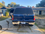 2002 Chevrolet Tahoe LT parked outside, featuring tinted windows and a clean title for sale.