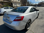 Silver 2011 Honda Civic Coupe from the rear, showcasing sleek design and low mileage of 121,000 miles.