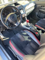 Interior view of a 2016 Subaru WRX STI with sporty seats and modern dashboard features