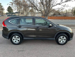 2013 Honda CR-V in dark color, 102,000 miles, well-maintained with clean interior and exterior.