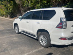 2021 Lexus GX 460 4WD in Starfire Pearl White with black leather, showcasing its sleek design and premium features.