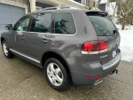 2010 Volkswagen Touareg TDI Highline parked on snowy driveway, features rear locking differential and excellent body condition.