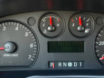 Dashboard of a 2004 Ford Taurus SES showing mileage and fuel gauge, with 120k original miles.