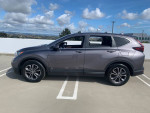 2021 Honda CR-V EX in showroom condition, gray color, parked in sunny outdoor setting.