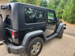 2010 Jeep Wrangler Mountain Edition with minor scrapes, manual transmission, clean title for sale.