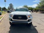 Front view of a 2022 Toyota Tacoma SR 4WD with alloy wheels, showcasing its sleek design and excellent condition.