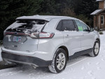 2017 Ford Edge SEL FWD with 71000 miles parked in snow, showcasing its sleek design and features.