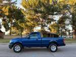 2008 Ford Ranger in excellent condition with 76,000 miles parked under trees