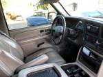 Interior view of a 2005 Chevrolet Tahoe Z71 with leather seats and aftermarket backup camera.