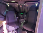 Interior view of 2009 Freightliner Sprinter Van with two seats and dashboard details.
