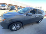 2014 Nissan Rogue SL FWD in gray color parked, showcasing exterior features and alloy wheels.
