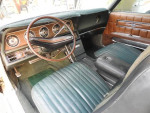Interior of a 1971 Ford Thunderbird showing original leather seats and dashboard in good condition.