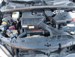 Engine compartment of a 2007 Lexus RX400h hybrid, showcasing battery and components.