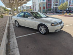 2004 Lincoln LS sedan with low mileage parked in a lot, featuring pristine condition and fully loaded amenities.